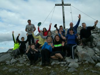 walkers at the cross of Muckish